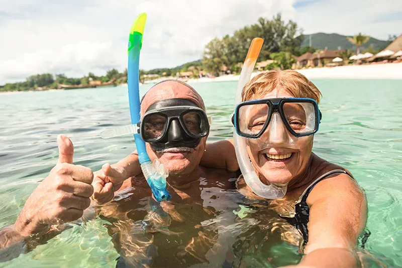 Senior couple scuba diving